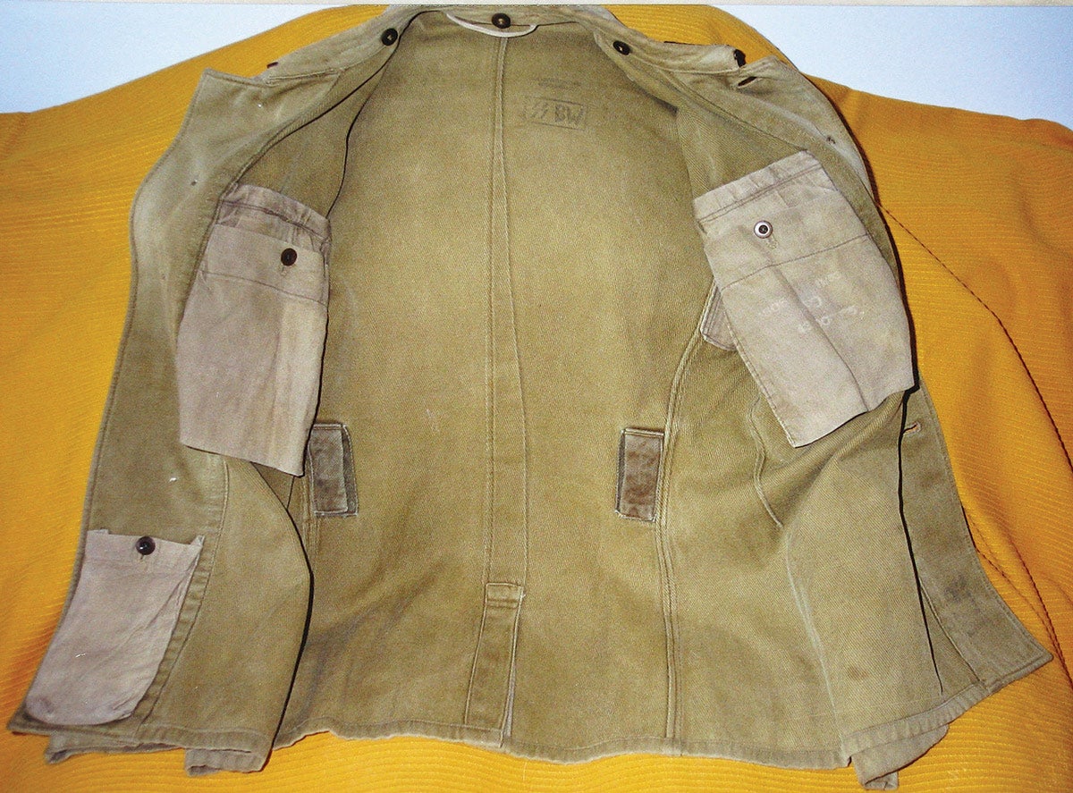 The rare SD drill tunic shows SS VT type twisting around the collar, a carryover from the early SS police.