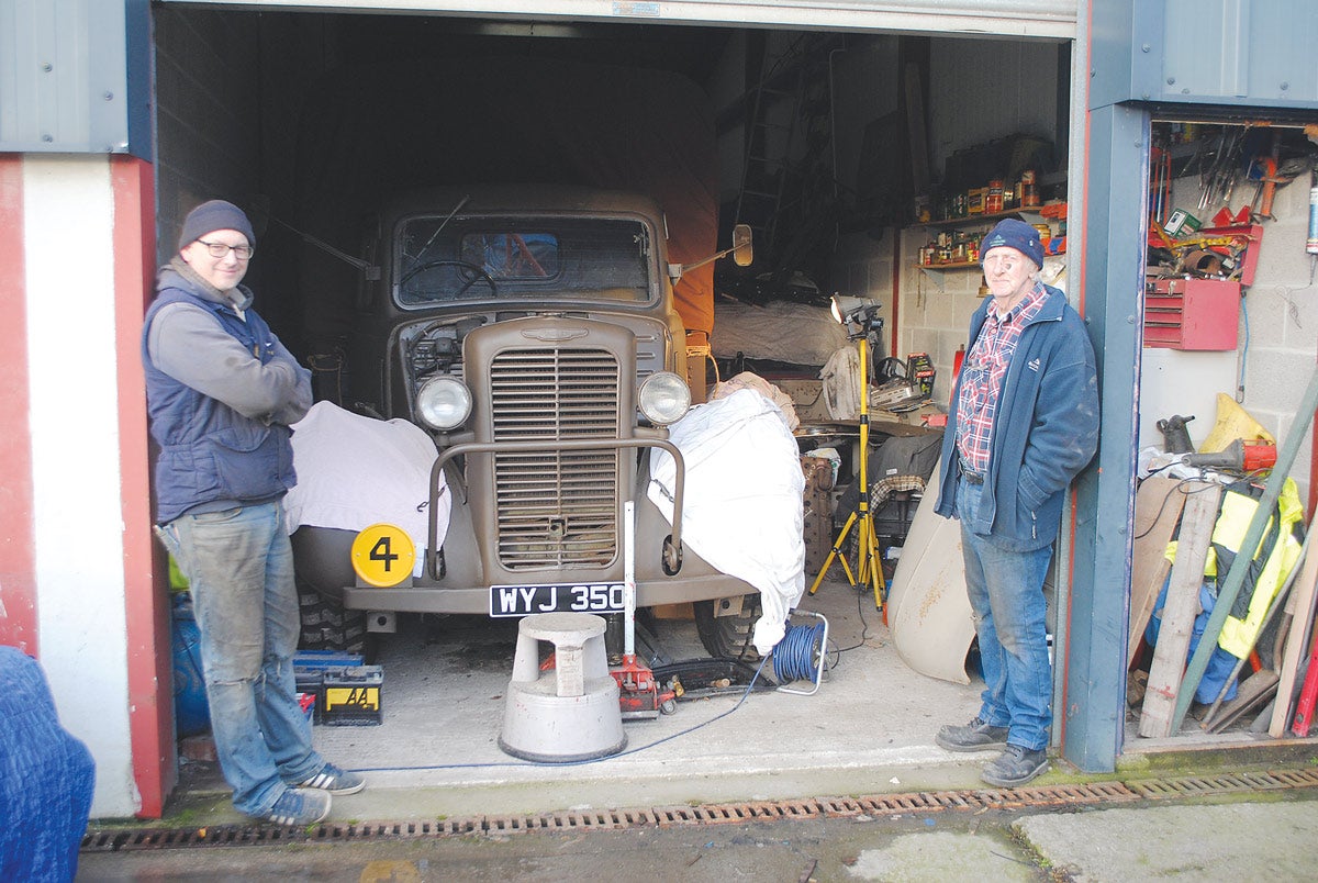 The Hann father and son enterprise restoration team, Kevin on the left and Richard on the right, in front of their workshop which has all the right tools for the right job.