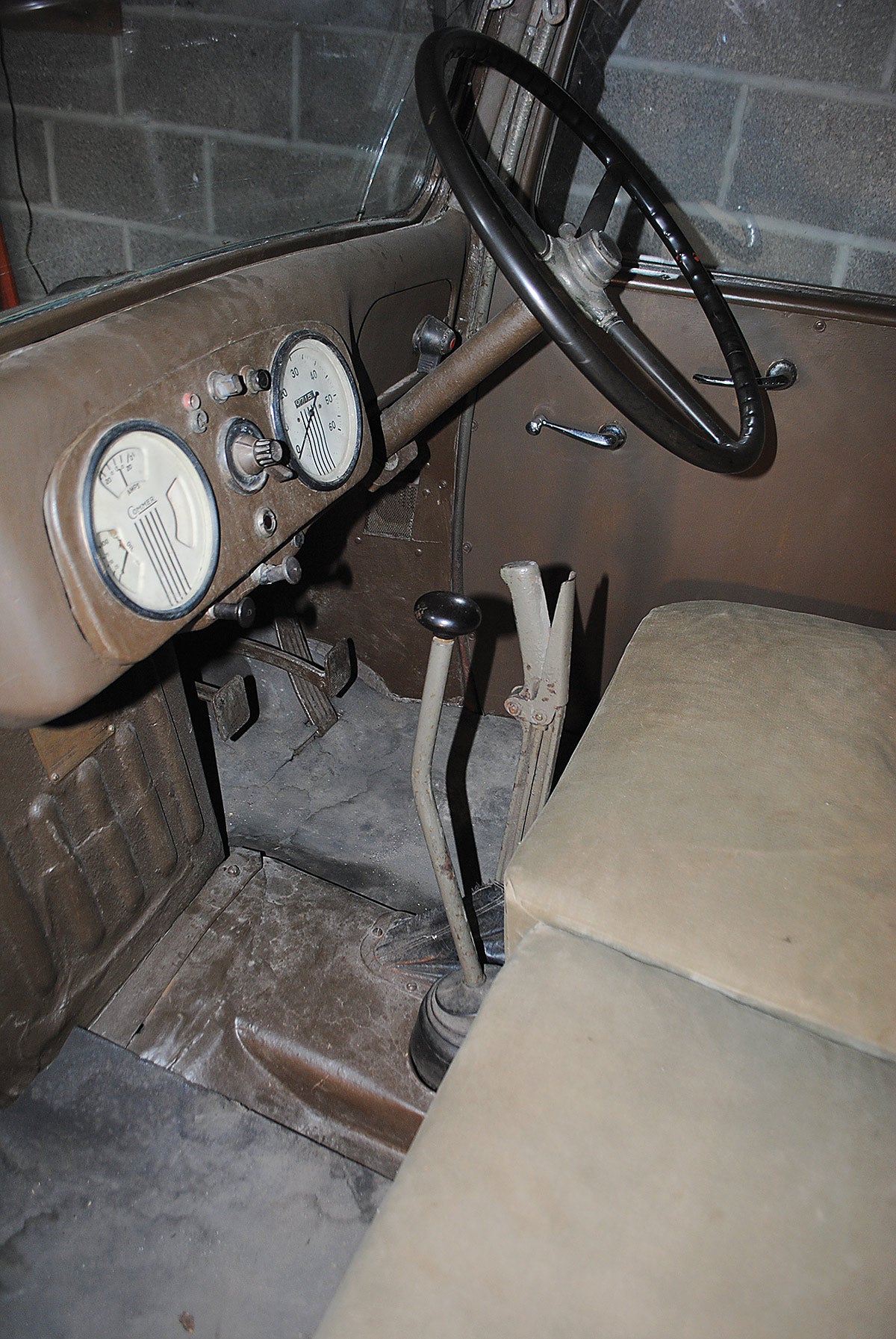 The Q2’s driver’s cab was rudimentary, but at least was better protected than other vehicles. The foot pedals, gear lever and hand brake and dials would have kept the driver busy.