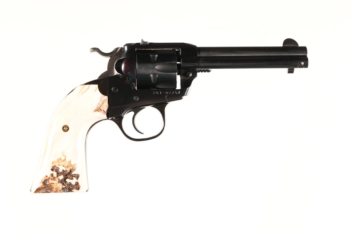 Customized Ruger New Model Single-Six Bisley Revolver, 22 LR, Serial # 261-02757 Fixed Sights, 4-5/8in barrel, blue, steel-grip frame with Sambar stag grips. Checkered hammer spur and ejector knob. Very Good condition showing no use. Provenance: Mike Stewart collection