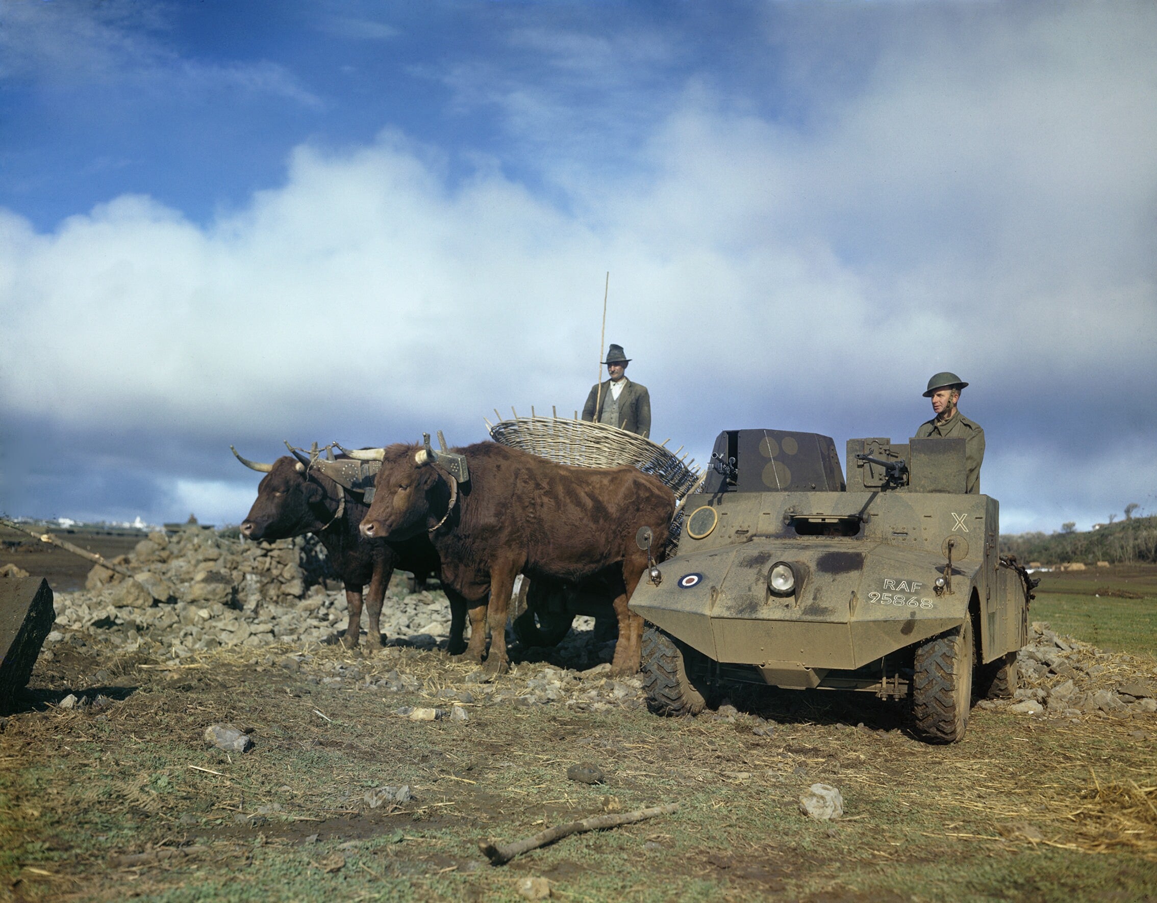 an_raf_morris_lrc_light_reconnaissance_car_alongside_a_bullock_cart_on_an_airfield_in_the_azores_january_1944_tr1496.jpg